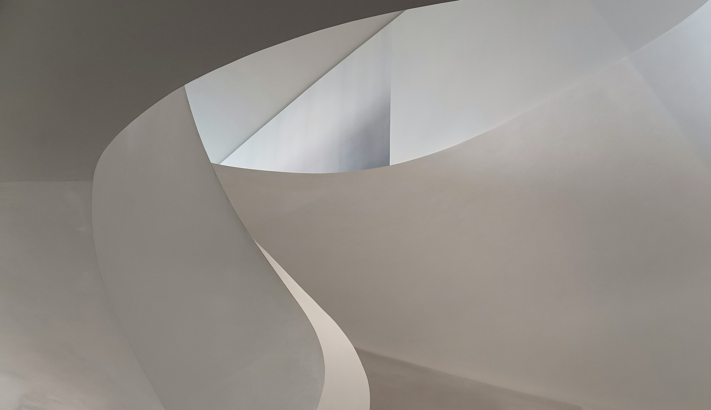 A sculptural architectural curve in soft natural light
